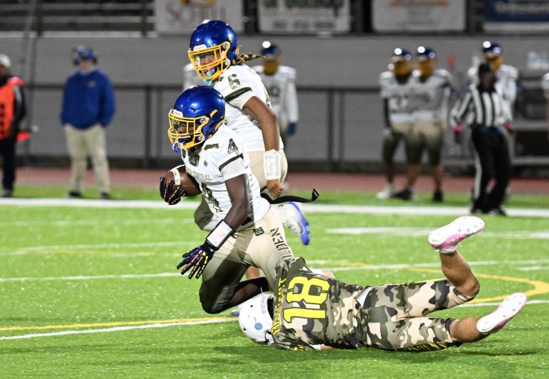 Cape’s Aidan Lehmuth brings down Central’s Devin Jackson.