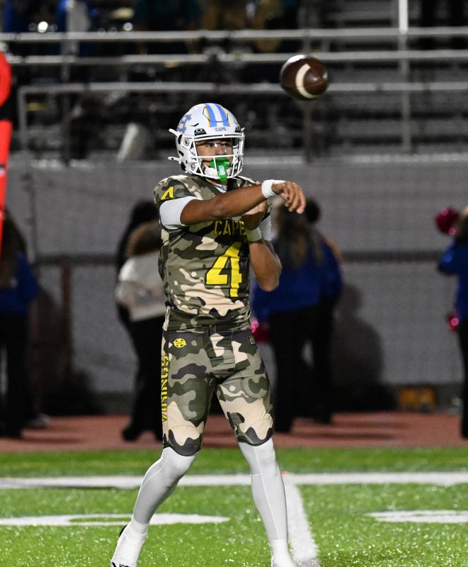 Junior Jameson Tingle hits a receiver downfield.