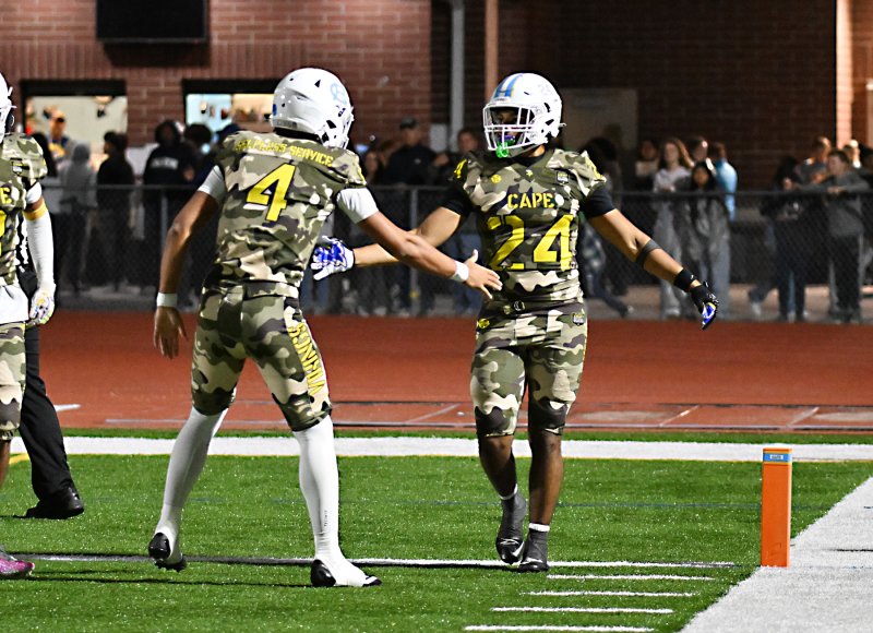 Jameson Tingle is the first to congratulate Quardell Richards after his touchdown.