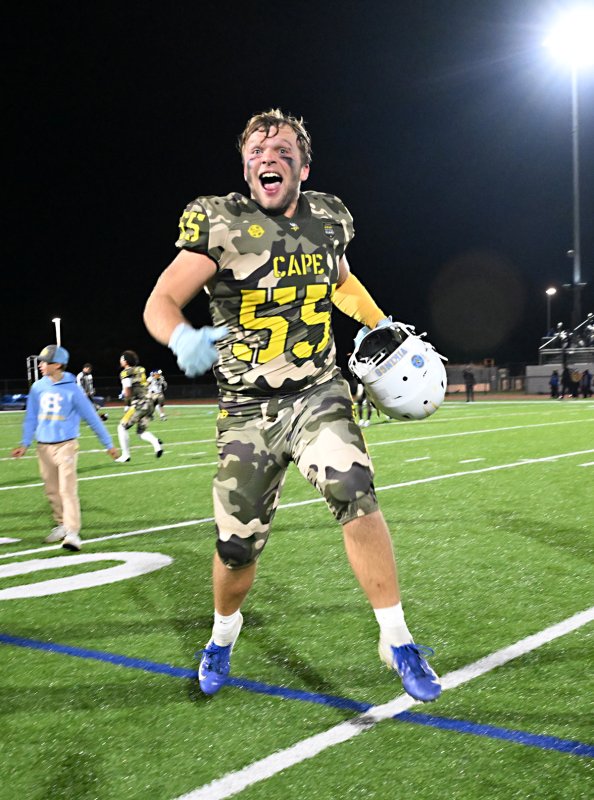 Cape’s Mason Schaffer celebrates Austin Tyndall’s field goal in the waning seconds of the game.