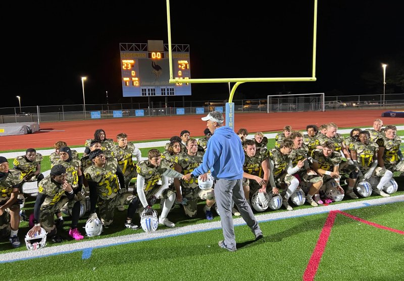 Cape coach Chip Knapp speaks to his players after the 23-21 win over Sussex Central.