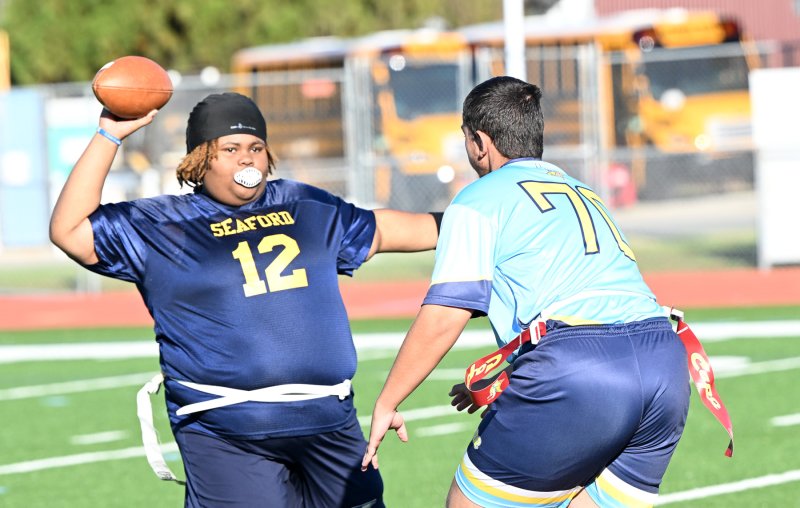 Cape rusher Austin Hastings puts pressure on Seaford quarterback Azeriah Collins.