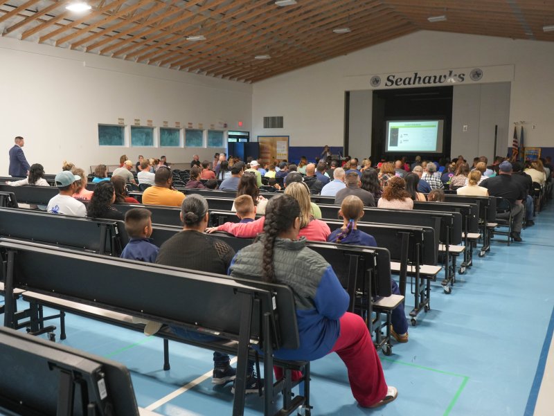 Sussex Academy elementary students and their families listen to a welcome speech at the Oct. 1 back-to-school night. ELLEN MCINTYRE PHOTOS