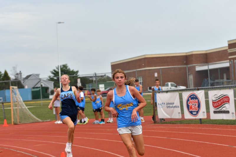 Brielle Antos of Beacon and Abby Bryson of Fred Thomas race to the finish.