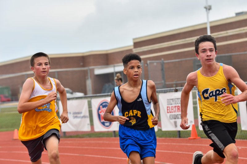 Ty Tillinghast of Mariner, Carter Leggins of Mariner and Andrew Tiedeman of Fred Thomas race each other to the finish line.