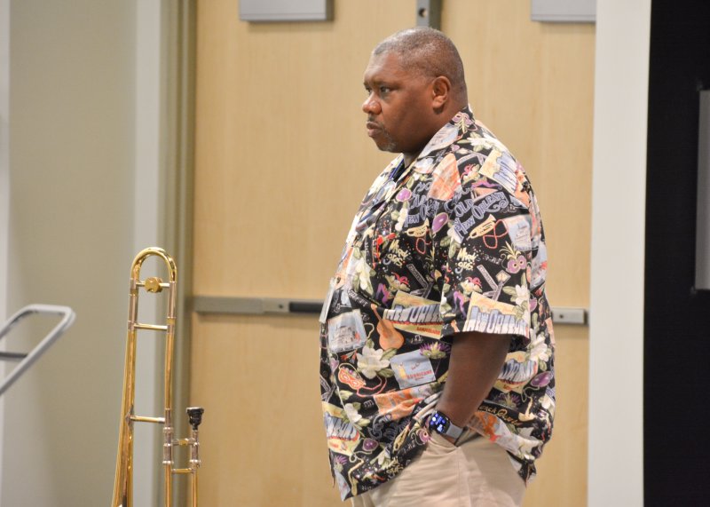 Wycliffe Gordon listens closely as the jazz ensemble plays a piece for him.