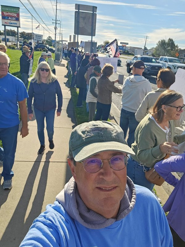 Tom Stock pauses for a selfie with others at the protest in Rehoboth Beach. TOM STOCK PHOTO