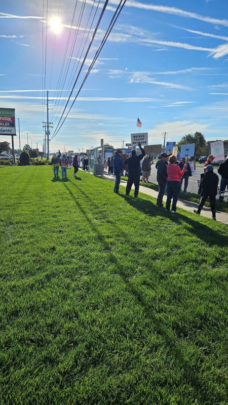 Protesters line the roadway on Route 1 Oct. 18, to participate in No Kings Day of Action. TOM STOCK PHOTO