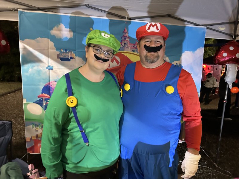 It’s not just the kids who dress up for Wicked Weekend, as adults do too. Kevin and Reinie Thompson of Edward Jones pass out candy as Mario and Luigi.