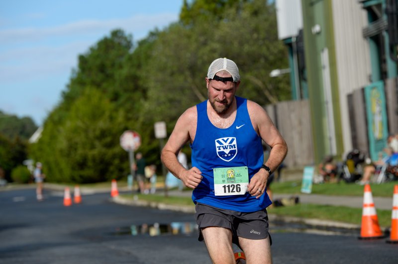Tim Pagano crosses the finish line in 22:00.