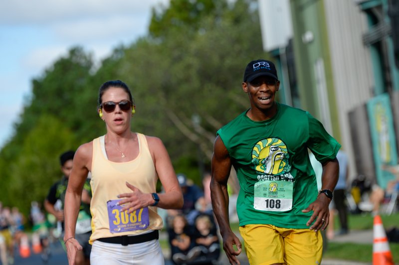 Brandi Fickes and Thomas Riddick cross the line in 28:28.