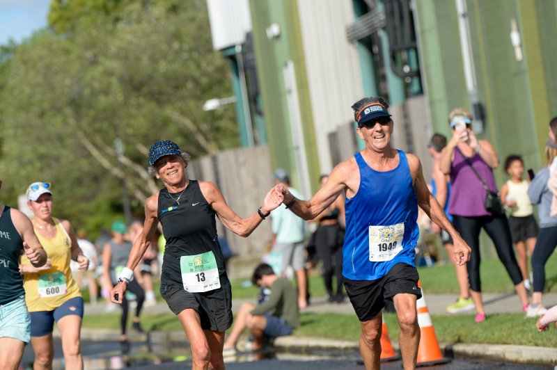 Debbie Isser and Bill Holdsworth finish the race together.