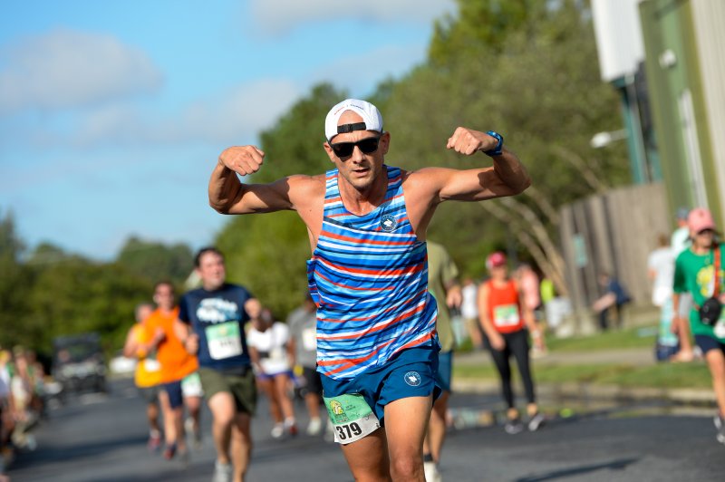 Kevin Kornegay flexes as he logs a time of 31:10.