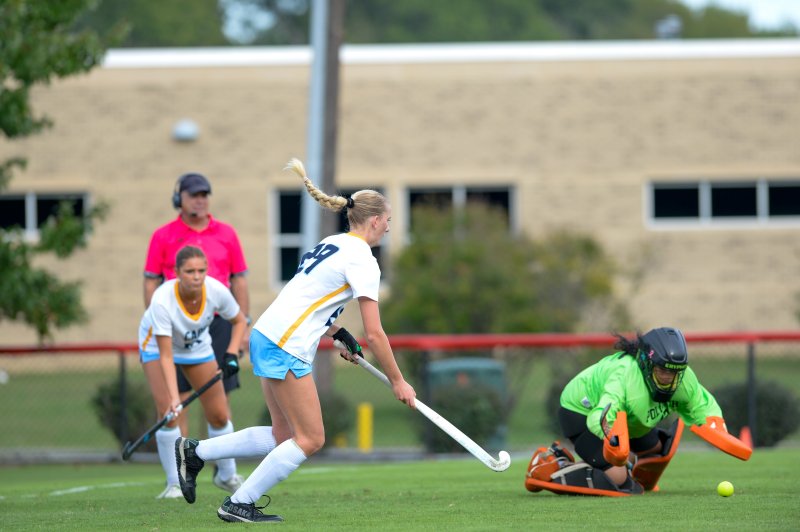 Ellen Ramsey pushes ball past a defender.