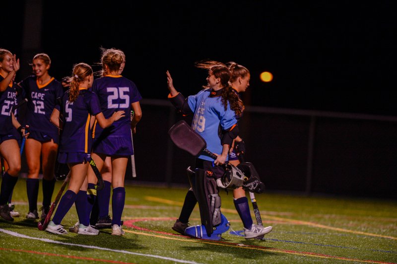 Senior goalie Izzy Mekulski accepts congrats from teammates.