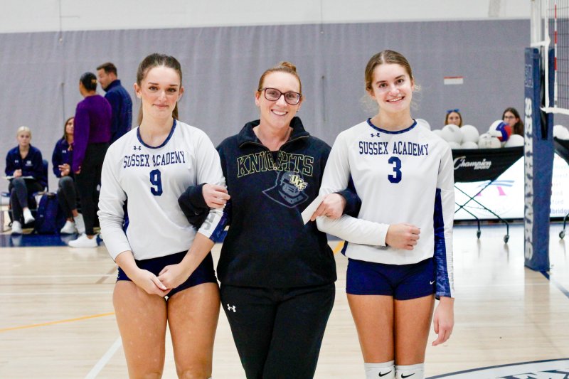 Megan Stevens sports a University of Central Florida hoodie while she walks with Aleida Calloway and Nadia Ahmed.