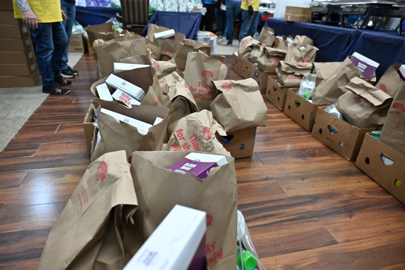 Donations and food packages are lined up and ready to be given out at the event.