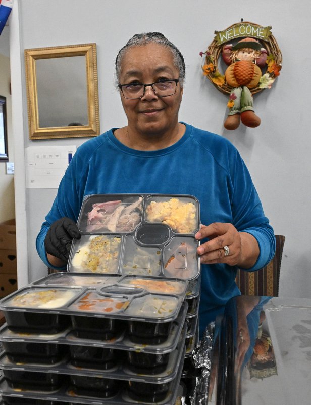 Becky Jones shows a takeout plate of delicious food.