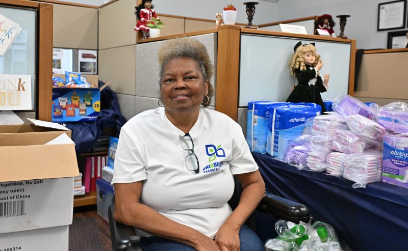 Founder and CEO Helena Gibbs helps oversee loading of the packages.