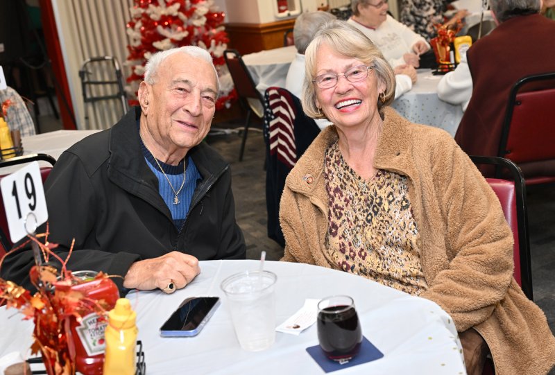 Awaiting the dinner are friends Don Marcellino and Sandy Gerald.