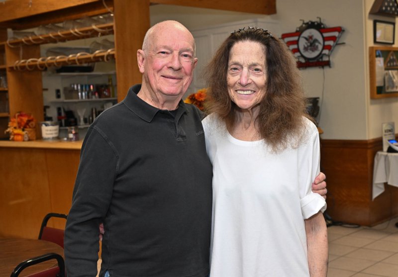 Arriving at the dinner are Bob, left, and Renee Deligny.