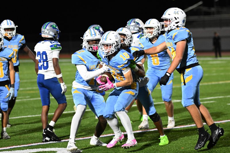 Cape’s kickoff team celebrates the fumble recovery by Cape’s Aidan Lehmuth.