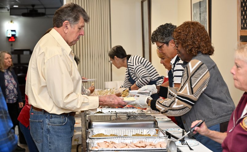 Larry Sparr gets his meal from the auxiliary ladies.