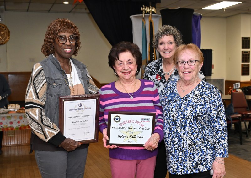 Roberta Bass is presented with the 2025 Unit Member of the Year plaque and the 2025 State of Delaware Outstanding Member of the Year. Shown are (l-r) Tina Washington, auxiliary historian; Bass; Beth McGinn, auxiliary vice president; and June Jones, auxiliary president.