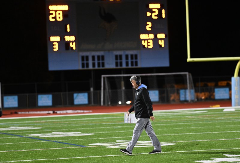 Cape head coach Chip Knapp walks back to the sideline after going over scenarios for the last 2:30.