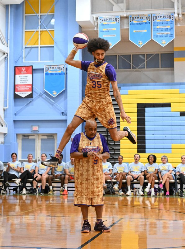 Sky-Rise jumps over A-Train, aka Arnold Bernard, during the introductions.