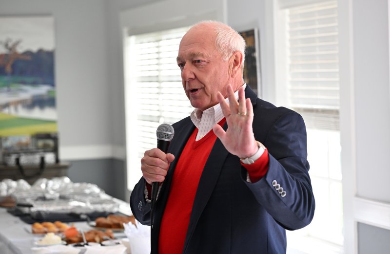 Harry Baumes, president of the Baywood Homeowners Association, welcomes guests and thanks the vets for their service.
