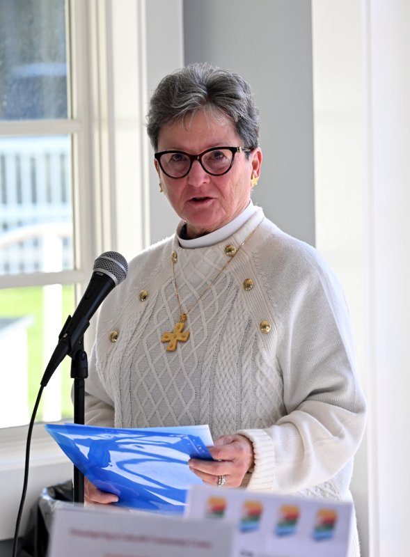 The Rev. Judy Rhodes delivers a prayer at the event.