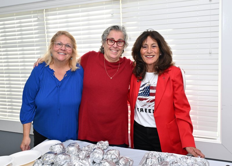 Celebration committee members are (l-r) Debbie Wilkins; Dawn Jaicks, activities chair; and Terry Stewart help serve the after-celebration meal.