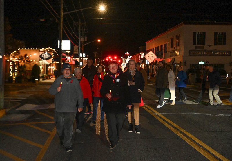 Kevin Pelland and Leslie Ledogar lead the 2024 candlelight procession from CAMP Rehoboth to All Saints’ Church for the World AIDS Day service of hope and remembrance. DAN COOK PHOTO