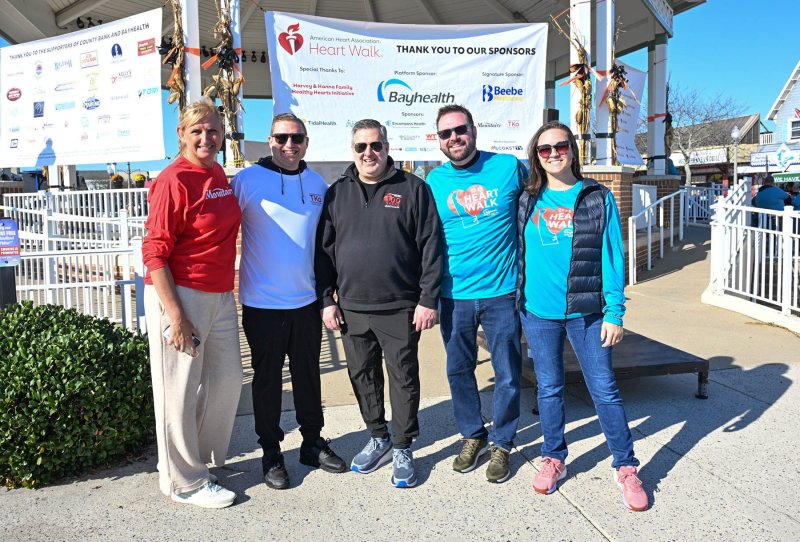 Awaiting the walk are (l-r) Cathy Bassett, Mountaire director of communications; Drew DiFonzo of TKO Hospitality; Jim Murphy, American Heart Association’s executive director for Delaware; and Ben and Sarah Collins, outgoing co-chairs for the Southern Delaware Heart Walk.