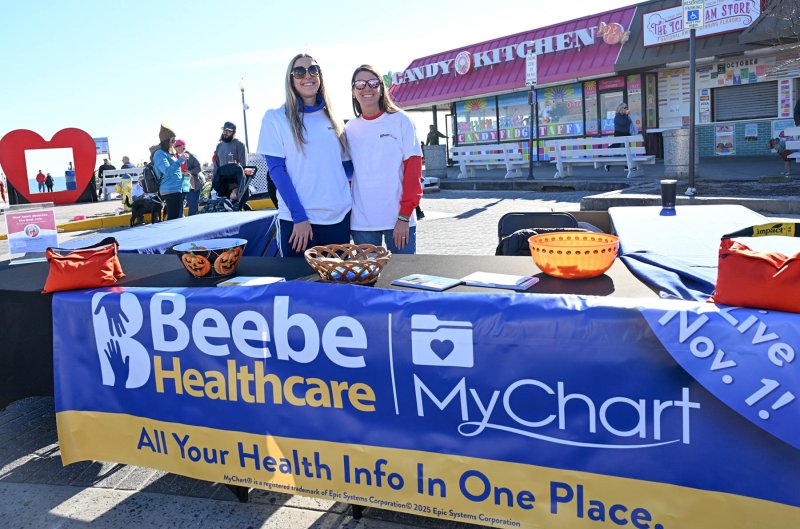 Cristen Owen, community and employee engagement coordinator, left, and Mary Green, director of marketing, work the Beebe Healthcare information booth.