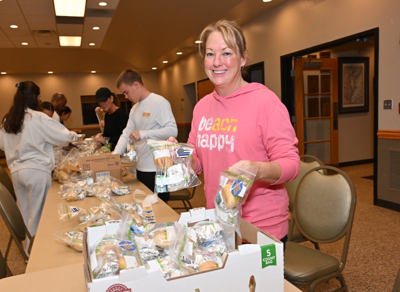 Crysti Davis helps to make the bread and butter bags.