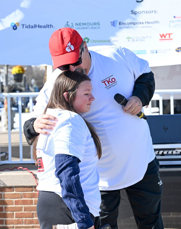 Heart recipient Bill Silva gets a hug from his daughter Michela, who is going to college to work in the medical field.