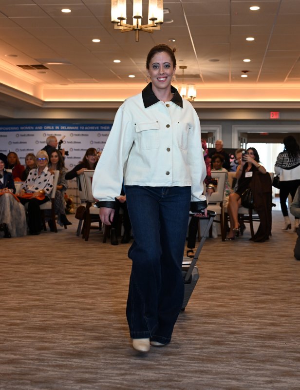 Samantha Facciolo wears a wide-leg jean and a cocoa jacket from outfit from Brooklyn Boulevard.