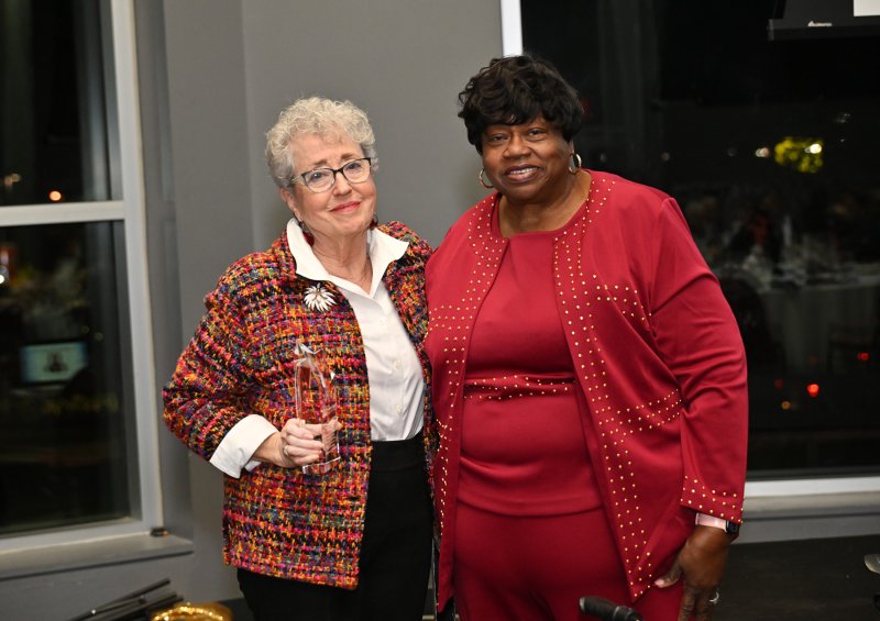 FSCAA Executive Director Bernice Edwards, right, presents the Legacy of Courage Award to Ruth Sakalowski.