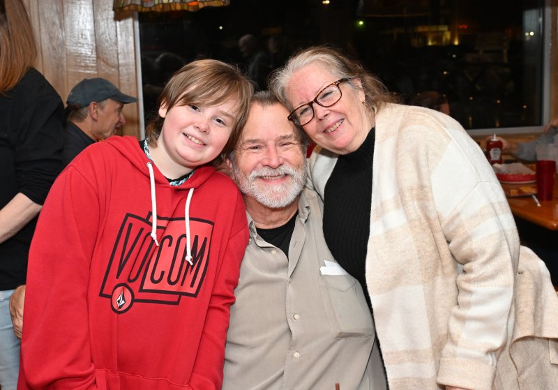 Katie’s son Logan, 10, hugs his grandparents Michael and Mary Lou Elrod.