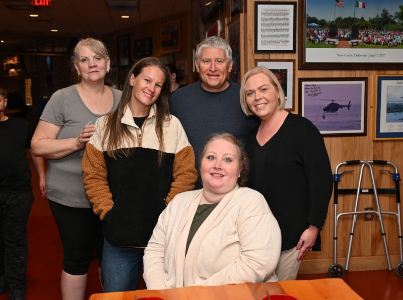 Showing their love to Katie Arietta are in back (l-r) Barbie Andrews, best friend Karli Crenshaw, Nicola owner Nick Caggiano Jr. and Kelly Small, fundraising coordinator for Nicola Pizza. Arietta sits in front.