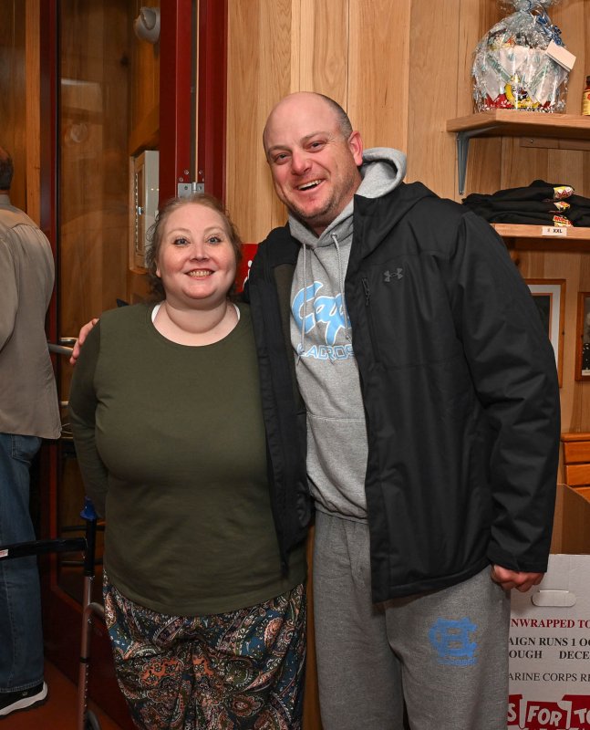 Katie Arietta gets a hug from local Franc Cook. Katie babysat for Franc and his younger brother James.