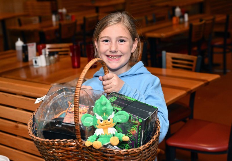 Briella Barlow won a basket of superheroes in the ticket raffle.