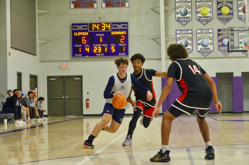 Senior Tate Sickler drives toward the paint against Bennett at the Delmarva Christian play day.