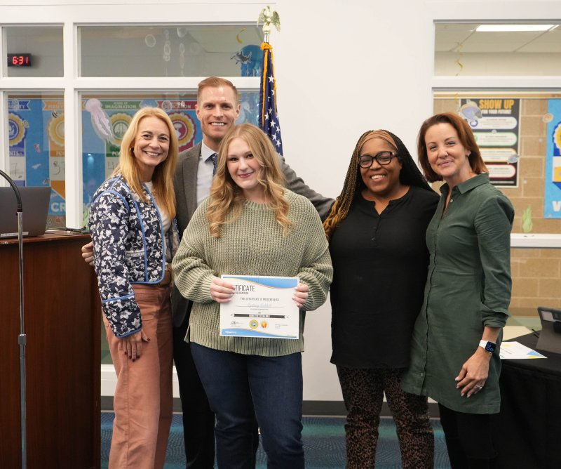 Sydney Babbitt, a Love Creek Elementary School substitute teacher, receives the Cape Henlopen School District's November Going the Extra Mile substitute award. Pictured are (l-r) Superintendent Jenny Nauman, Love Creek Assistant Principal James McDowell, Babbitt, Principal Equetta Jones and Board President Alison Myers.