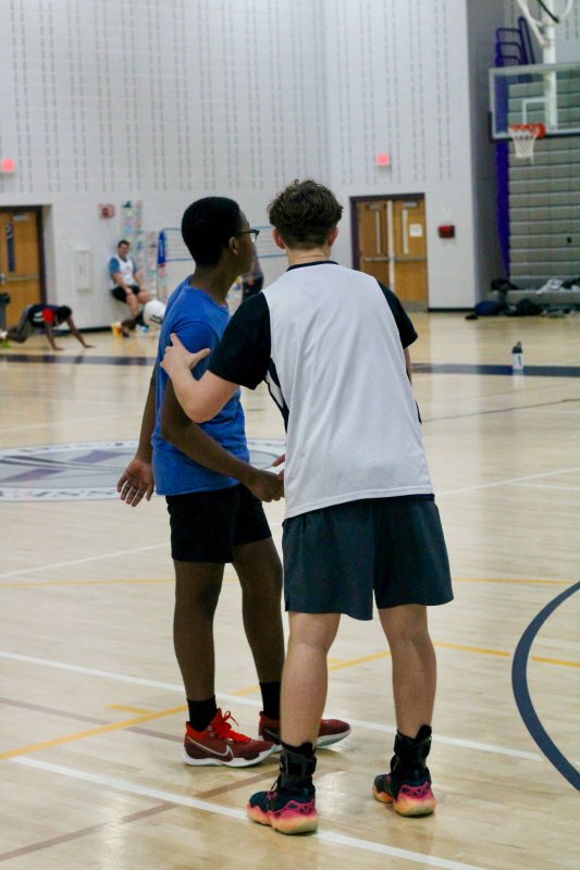 Senior Tate Sickler coaches up sophomore Jean-McKinny Platel.