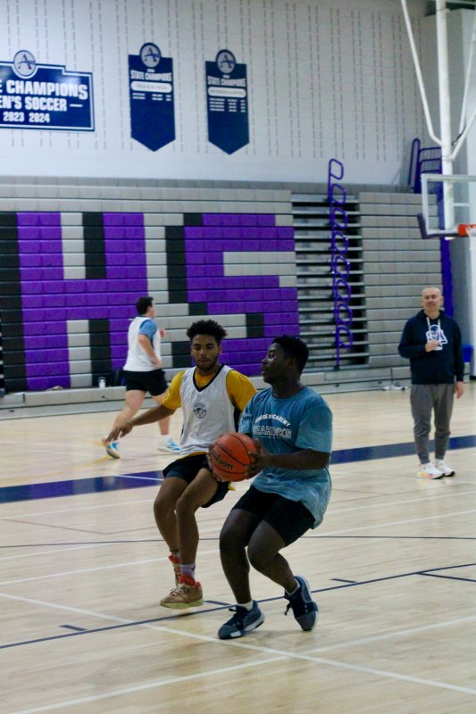 Sophomore Abi Cenou begins to elevate with Noah Bailey closing in.