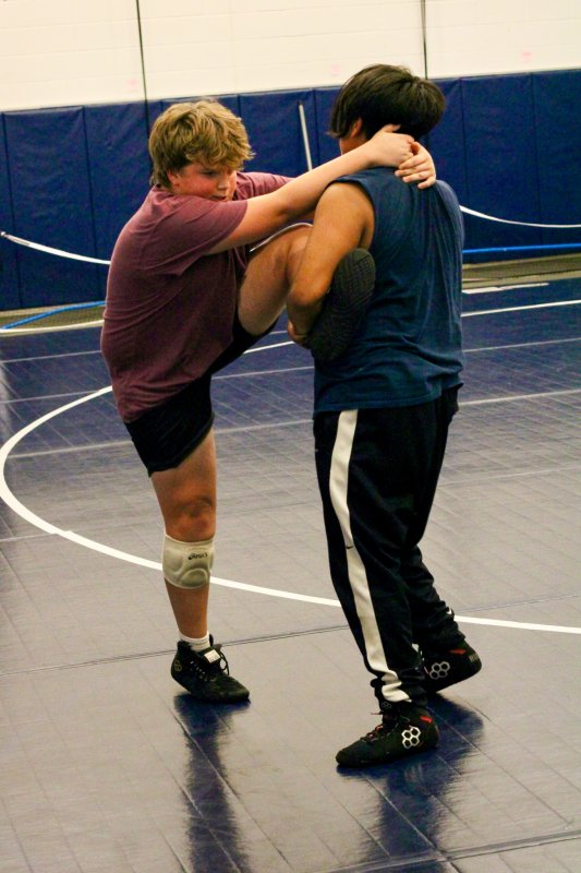 Asher Kern has his leg lifted by Mizeal Guevara Yoc.