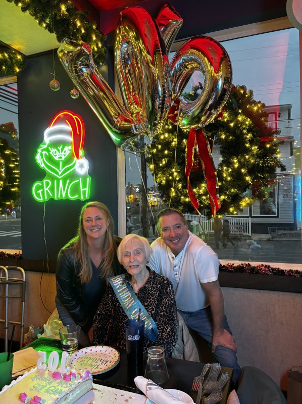 Bonnie McCarthy, middle, enjoys her 105th birthday party with Dewey Beach Mayor Bill Stevens, right, and his wife, Janine.